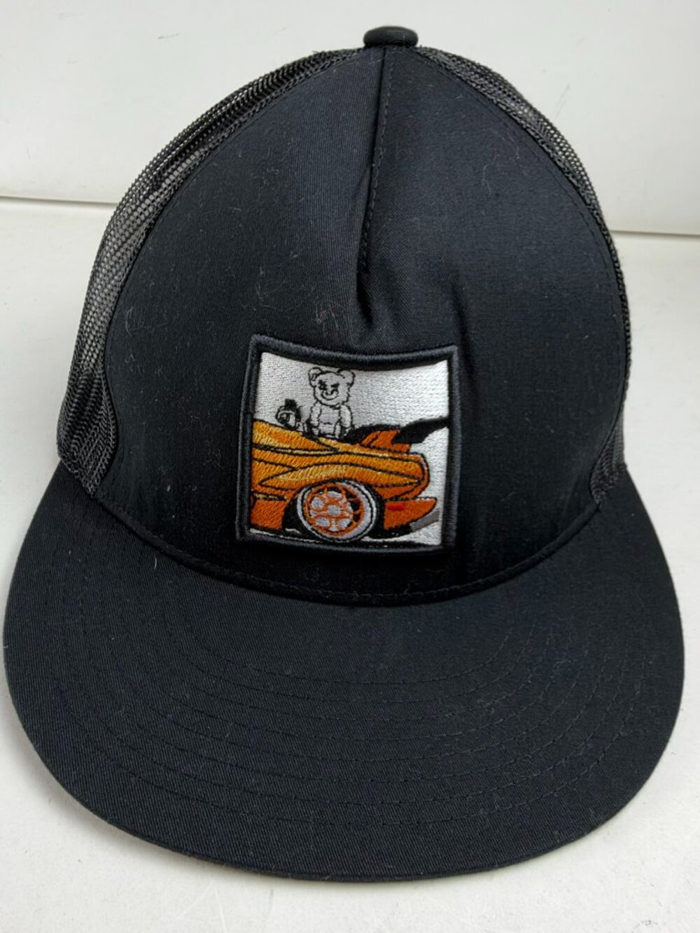 The Classics Yupoong Snapback Trucker Hat Black Mesh Bear Driving Orange Car